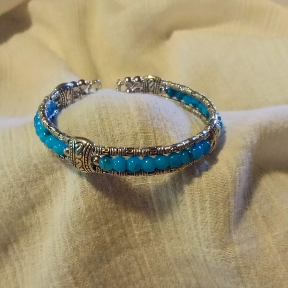 Silver and Blue Rice Bead Bracelet with Feather Charm - Picture 3 of 4